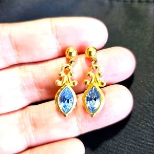 Dangling gold tone earring with blue.stone